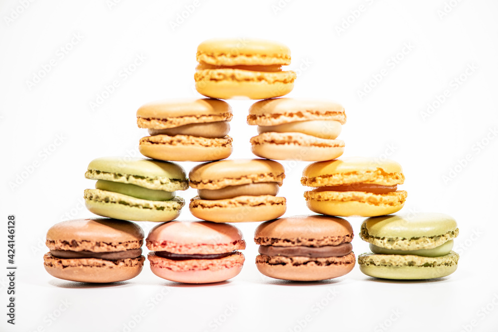 several multi-colored macaroon cakes on a white background several multi-colored macaroon cakes on a white background