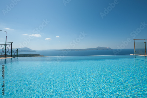 Luxury house with infinity pool over the ocean.