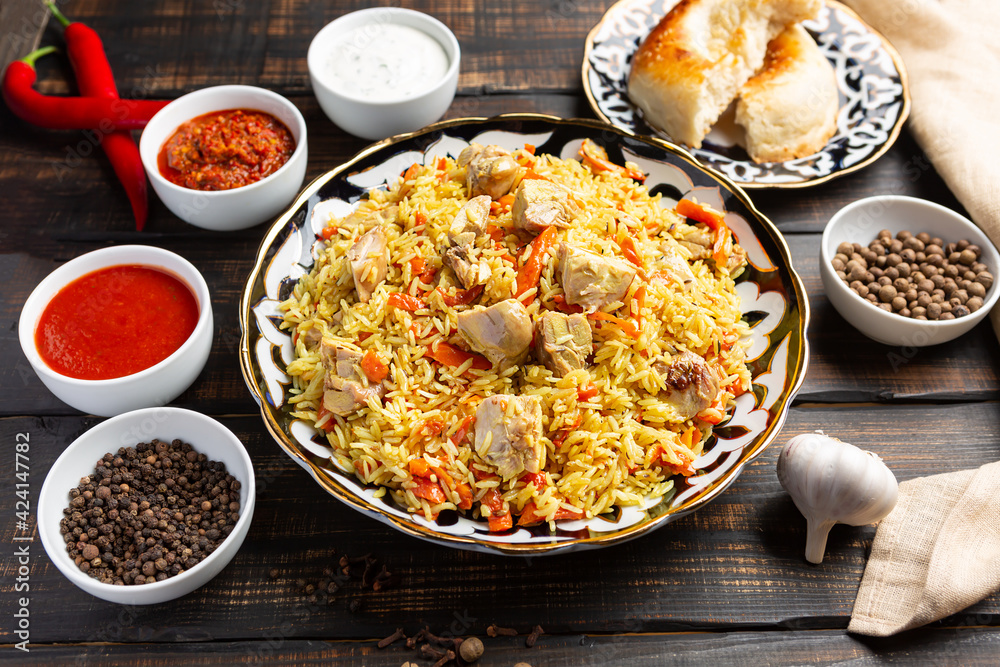 National Uzbek pilaf with meat in a cast-iron skillet National Uzbek pilaf with meat in a cast-iron skillet