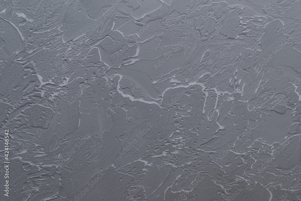 Gray background with textured paintable plaster. Decorative plastered venetian background. Cement texture. Gray background with textured paintable plaster. Decorative plastered venetian background. Cement texture.