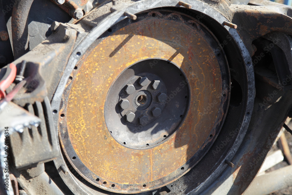 Old rusty truck motor flywheel closeup, clutch disk change lorry repair service Old rusty truck motor flywheel closeup, clutch disk change lorry repair service