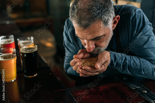 bartender serving beer in pub