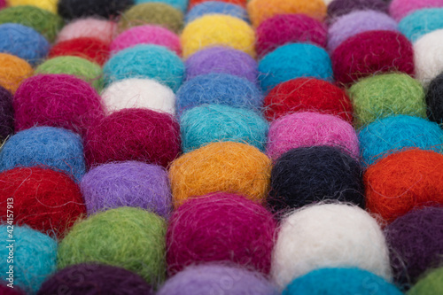 colored balls made of felt close-up