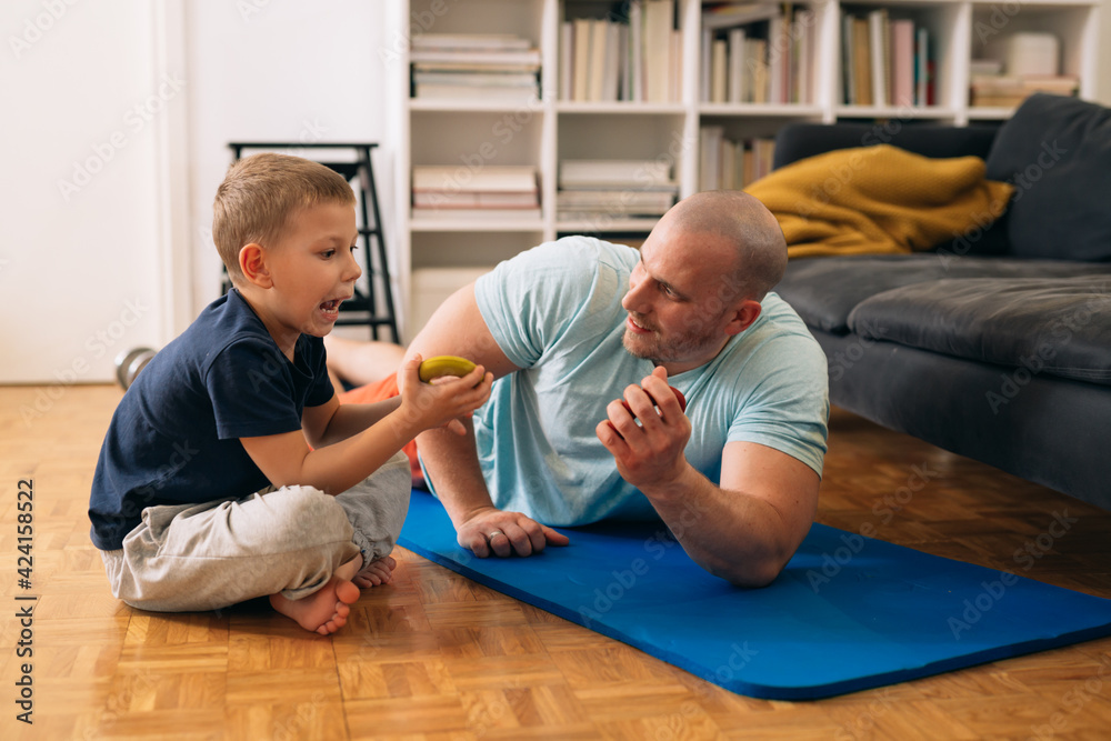 father workout training at home with his son father workout training at home with his son