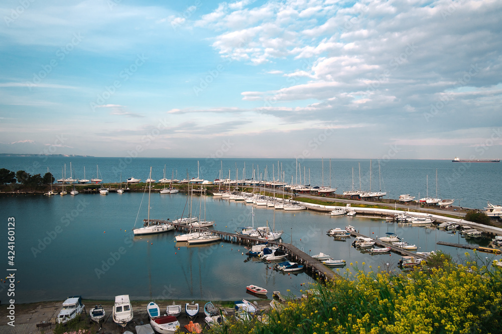 Panoramic high angle view of pier with sail boats moored.