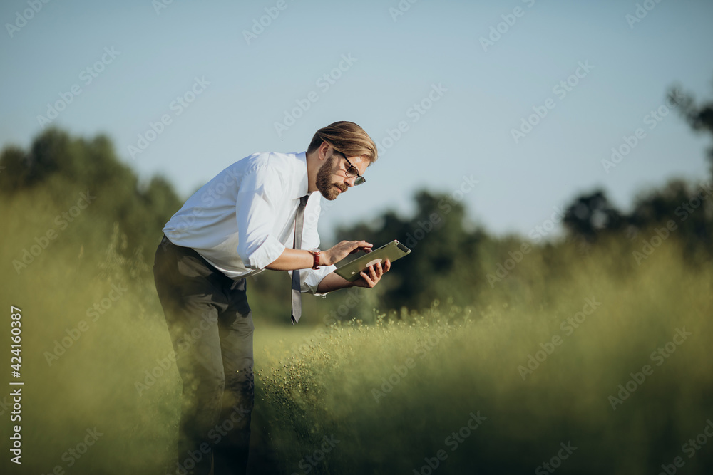 Farmer with a tablet outdoors Farmer with a tablet outdoors