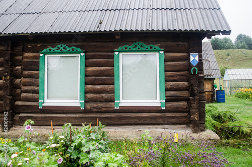 Russian Old Believers village in Latvia, Slutiski. Beautiful wooden house. photo