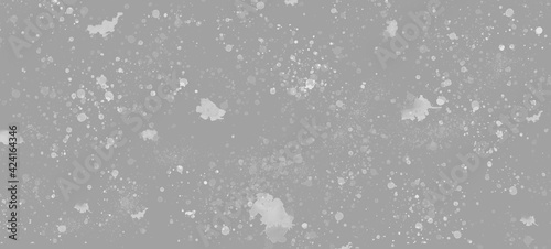 Gray discreet background with small specks and blots. Abstract background with space for text.