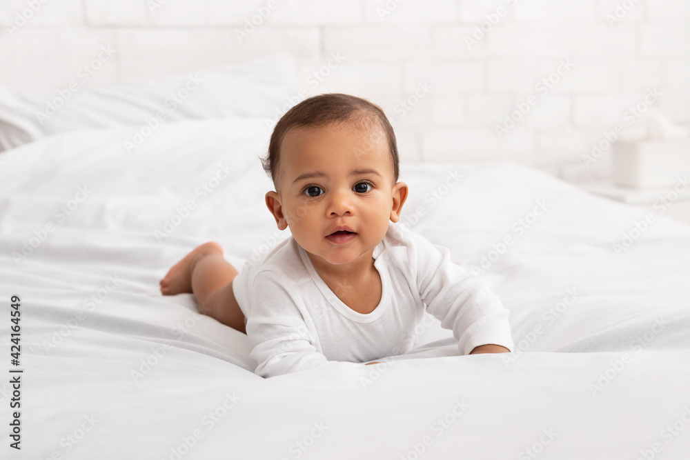Adorable Black Baby Toddler Crawling On Bed In Bedroom Indoor Adorable Black Baby Toddler Crawling On Bed In Bedroom Indoor