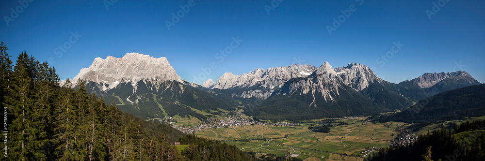 Fototapeta premium Panorama view Zugspitze mountain and Ehrwalder Sonnenspitze mountain in Tyrol, Austria