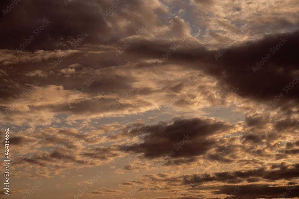 Fototapeta premium Sunset sky with orange clouds. Nature background.