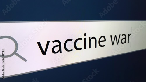 War vaccine at the end of a question mark written in a search bar with a cursor, a computer monitor, close-up with a camera zoom effect