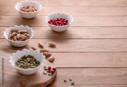 Healthy snacks. Variety of superfood: nuts, berries, grain, seed