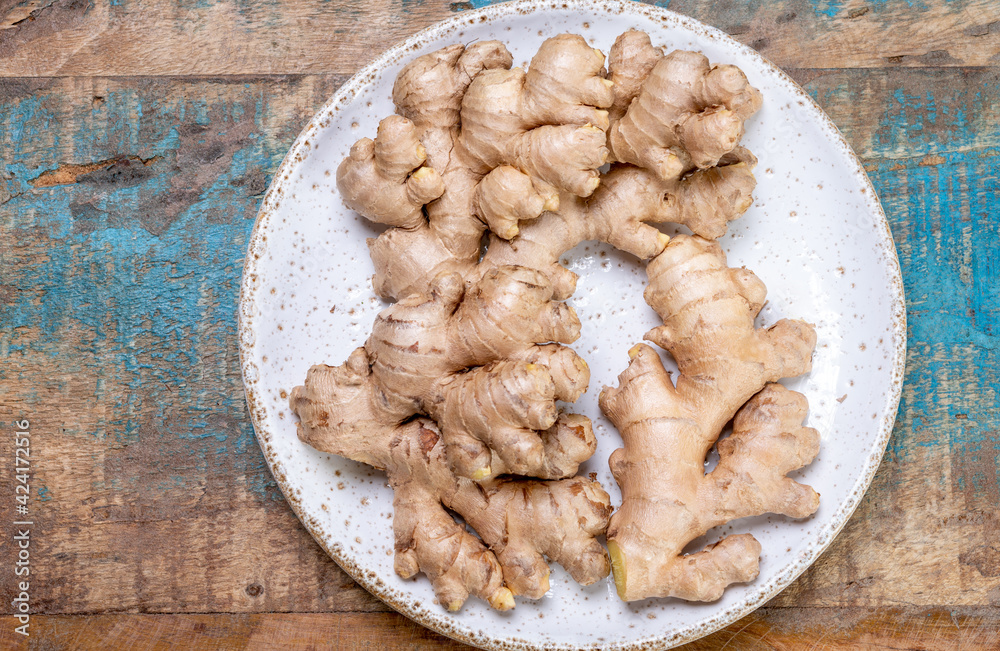 Fototapeta premium Fresh organic ginger roots, healthy food ingredient