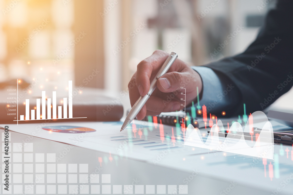 Business people or accountants are analyzing graphs on finance, investment, graph chart hologram in front, business strategy ideas, data analysis technology. Business people or accountants are analyzing graphs on finance, investment, graph chart hologram in front, business strategy ideas, data analysis technology.