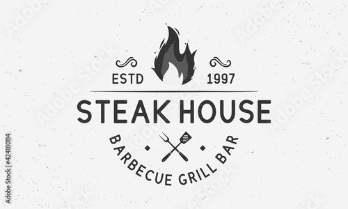 Barbecue, Grill logo. Vintage hipster BBQ logo template with fire flame, grill fork and spatula. Emblem, Poster for Steak House, Restaurant, Barbecue. Vector illustration