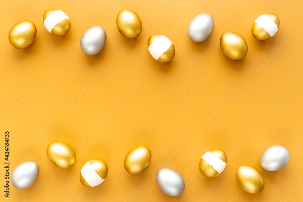 Golden and silver eggs frame. Wealth and good luck concept. Easter decoration Golden and silver eggs frame. Wealth and good luck concept. Easter decoration