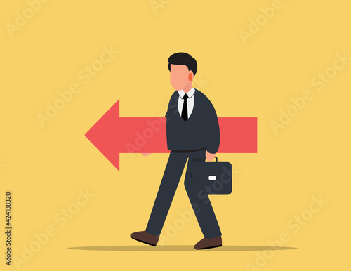 Businessman holding the red arrow. goal achievement concept.