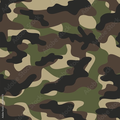 green camouflage texture with black spots seamless pattern. Vector trendy design.