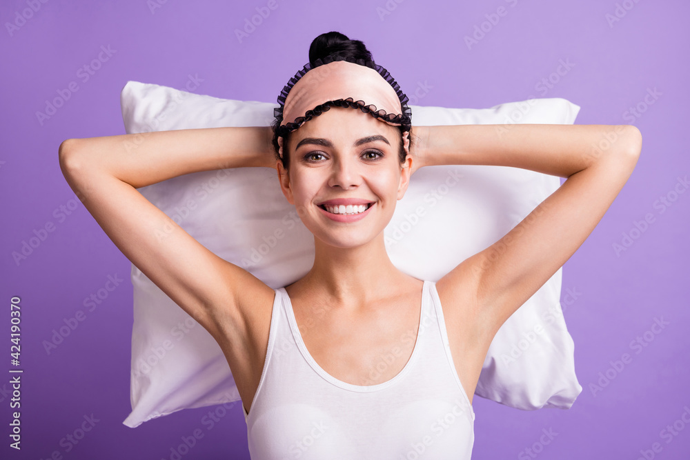 Photo portrait of dreamy woman in sleeping mask laying on pillow chilling isolated on pastel violet color background
