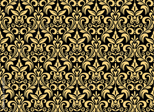 Wallpaper in the style of Baroque. Seamless vector background. Gold and dark blue floral ornament. Graphic pattern for fabric, wallpaper, packaging. Ornate Damask flower ornament