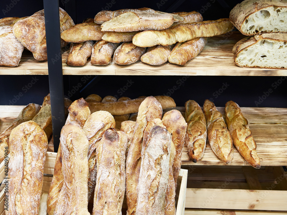 Bread baguettes in basket at baking shop