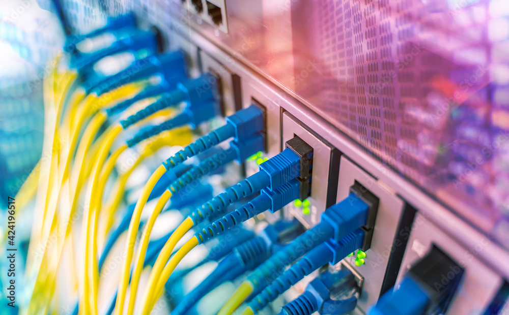 Fiber Optic cables connected to optic ports and UTP, Network cables