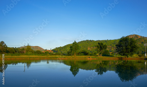 Fototapeta Naklejka Na Ścianę i Meble -  Landscape of countryside mountain and tree with mirror on water