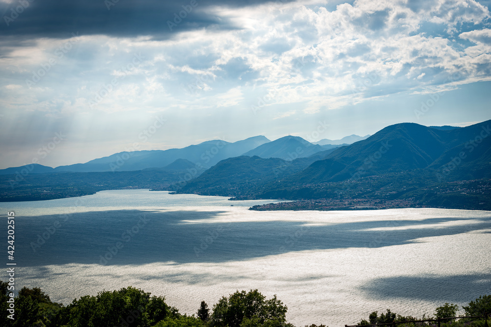 Lago di Garda. Elevated view of the Lake Garda with the Lombardy coastline seen from the Monte Baldo (Baldo Mountain). San Zeno di Montagna, Verona province, Italy, southern Europe. 