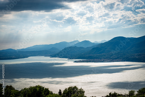 Lago di Garda. Elevated view of the Lake Garda with the Lombardy coastline seen from the Monte Baldo (Baldo Mountain). San Zeno di Montagna, Verona province, Italy, southern Europe. 