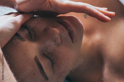 Relaxing massage. SPA treatments for face. Close-up of cosmetic procedures. Woman enjoying massage. 