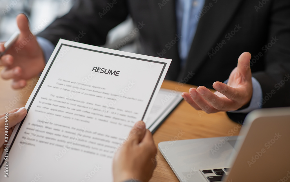 Employer or selection committee is reading the candidate's resume and competence background, History exam and work ability, Employment and Recruitment Concept. Employer or selection committee is reading the candidate's resume and competence background, History exam and work ability, Employment and Recruitment Concept.