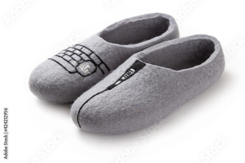 Felt slippers on white background in closeup