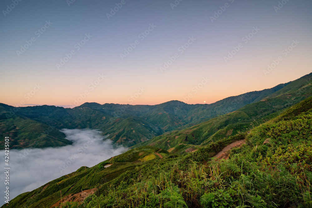 Ta Xua is a famous mountain range in northern Vietnam. All year round, the mountain rises above the clouds creating cloud inversions. Ta Xua is a famous mountain range in northern Vietnam. All year round, the mountain rises above the clouds creating cloud inversions.