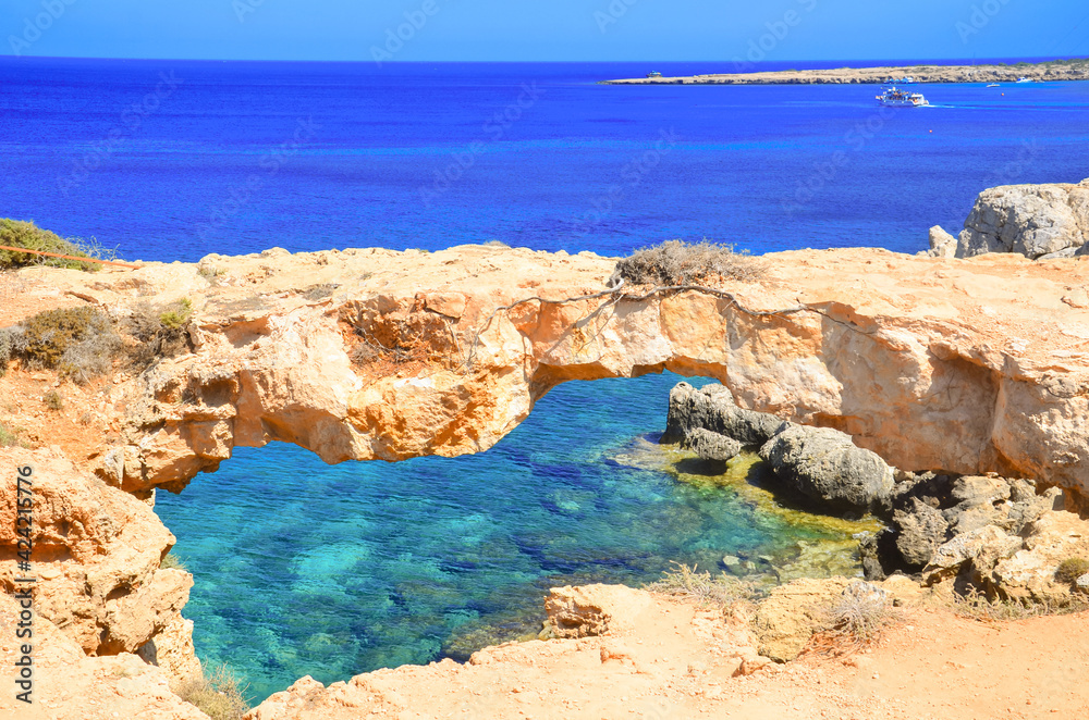 Seascape, sea waves break on the rocks, Lovers' Bridge, Cyprus, Cape Kavo Greko