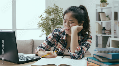 chienese woman feeling studying is tedious