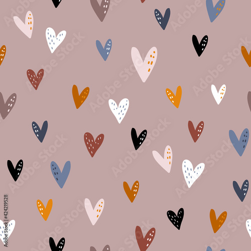 Seamless pattern design with colorful hearts in boho style. Vector romantic background. Great for fabric, textile, apparel.