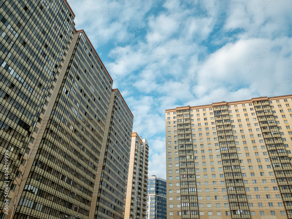 High-rises apartment buildings against the sky High-rises apartment buildings against the sky