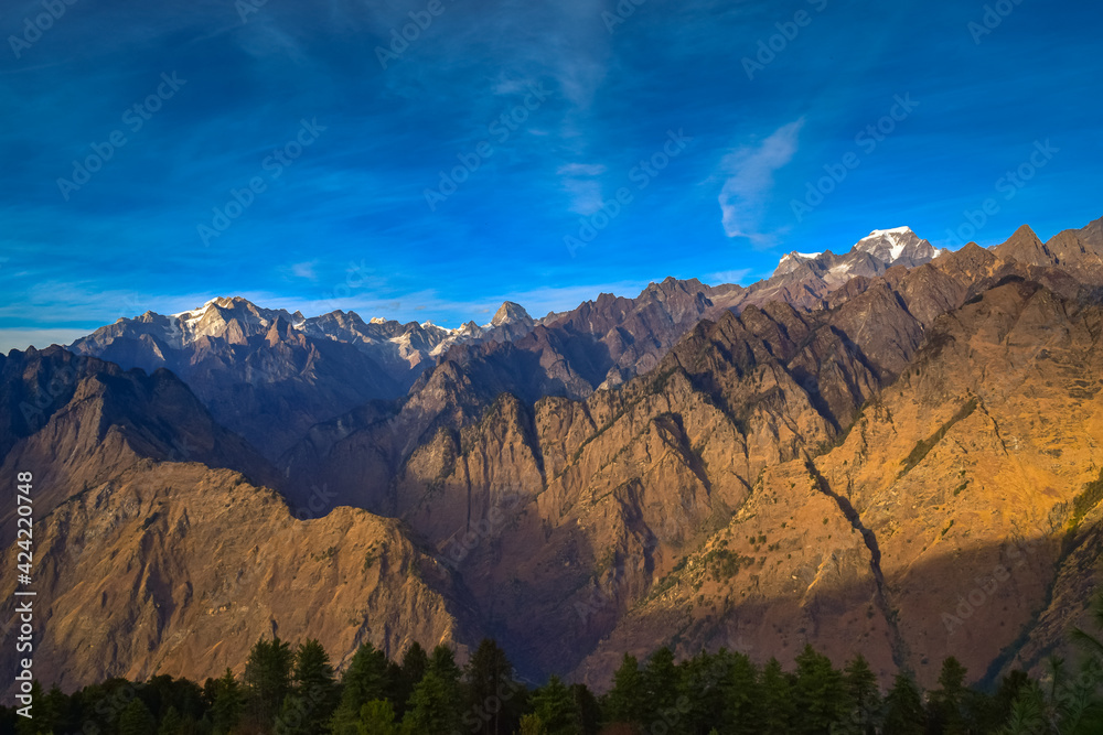 Mesmerizing view of Kamet, Parvati and Neelkanth mountains of Garhwal Himalayas from Kuari pass hiking trail near Auli, Uttarakhand, India.