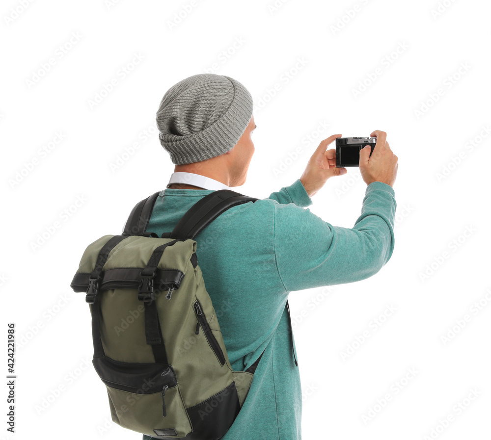 Man with backpack taking picture on white background. Autumn travel Man with backpack taking picture on white background. Autumn travel