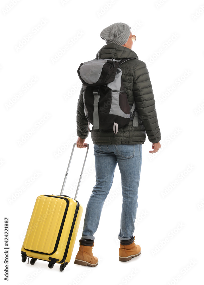 Man with suitcase and backpack walking on white background, back view. Winter travel Man with suitcase and backpack walking on white background, back view. Winter travel
