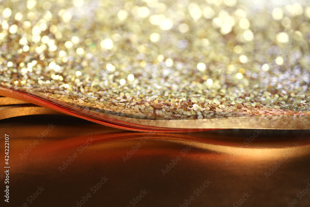 Abstract light blur blink sparkle defocus backgound. Gold (bronze) glitter shine dots confetti. Abstract light blur blink sparkle defocus backgound. Gold (bronze) glitter shine dots confetti.