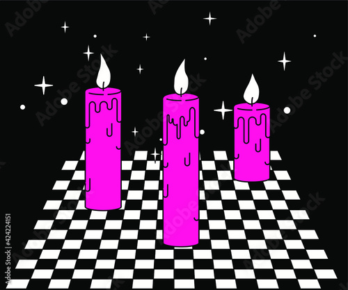 Wax candles on a checkered table. A magical secret esoteric ritual.