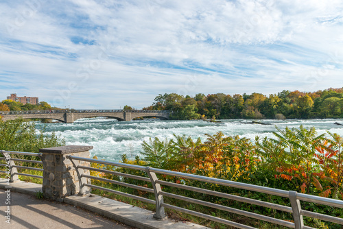 Niagara river above Niagara Falls with bright autumn trees