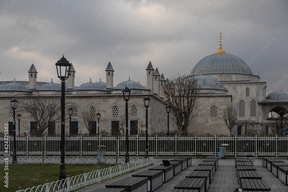 Sultan Ahmet Türbesi also known as Tomb Of Sultan Ahmet is located at the square between Blue Mosque and Hagia Sophia. The building made of gray stone and have one main large dome and few smaller ones
