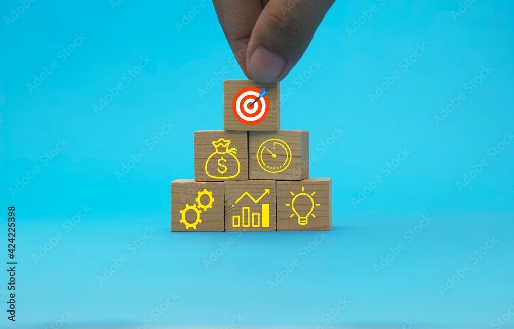 Concept of business strategy and action plan. Wood cube block stacking with icon
Concept of business strategy and action plan. Wood cube block stacking with icon