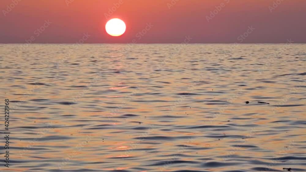 Colorful sunset over the sea with small waves. Black Sea, Sochi, Russia. Colorful sunset over the sea with small waves. Black Sea, Sochi, Russia.