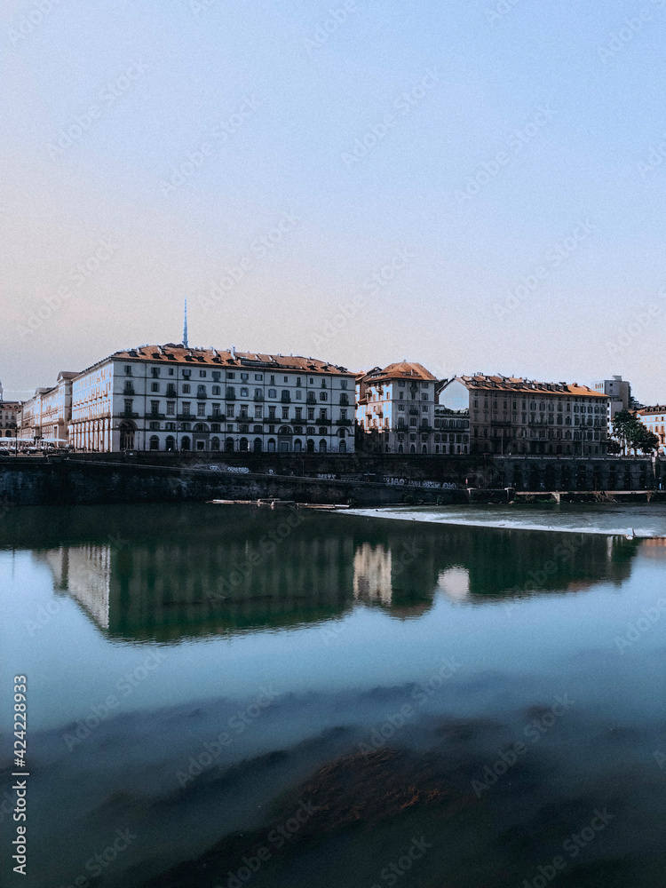 Architecture, buildings and reflections in the river in the city of Turin