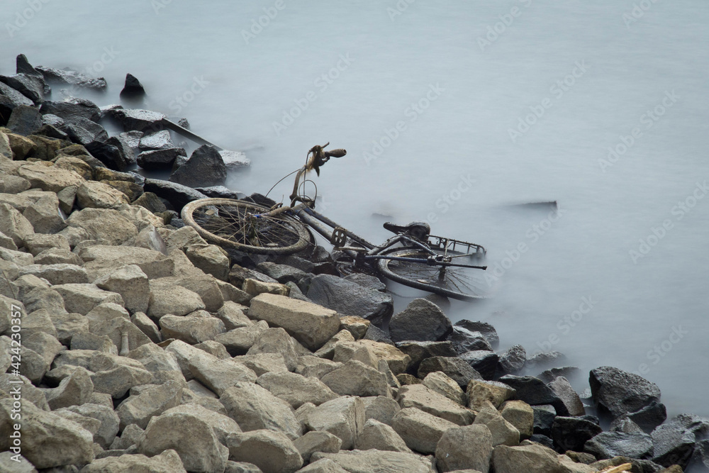 An old bicycle thrown into the Thames in central London.