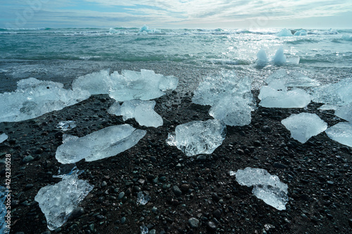 Diamond Beach (Jokulsarlon) landscape in East Iceland. Ice on black volcanic sand in the day